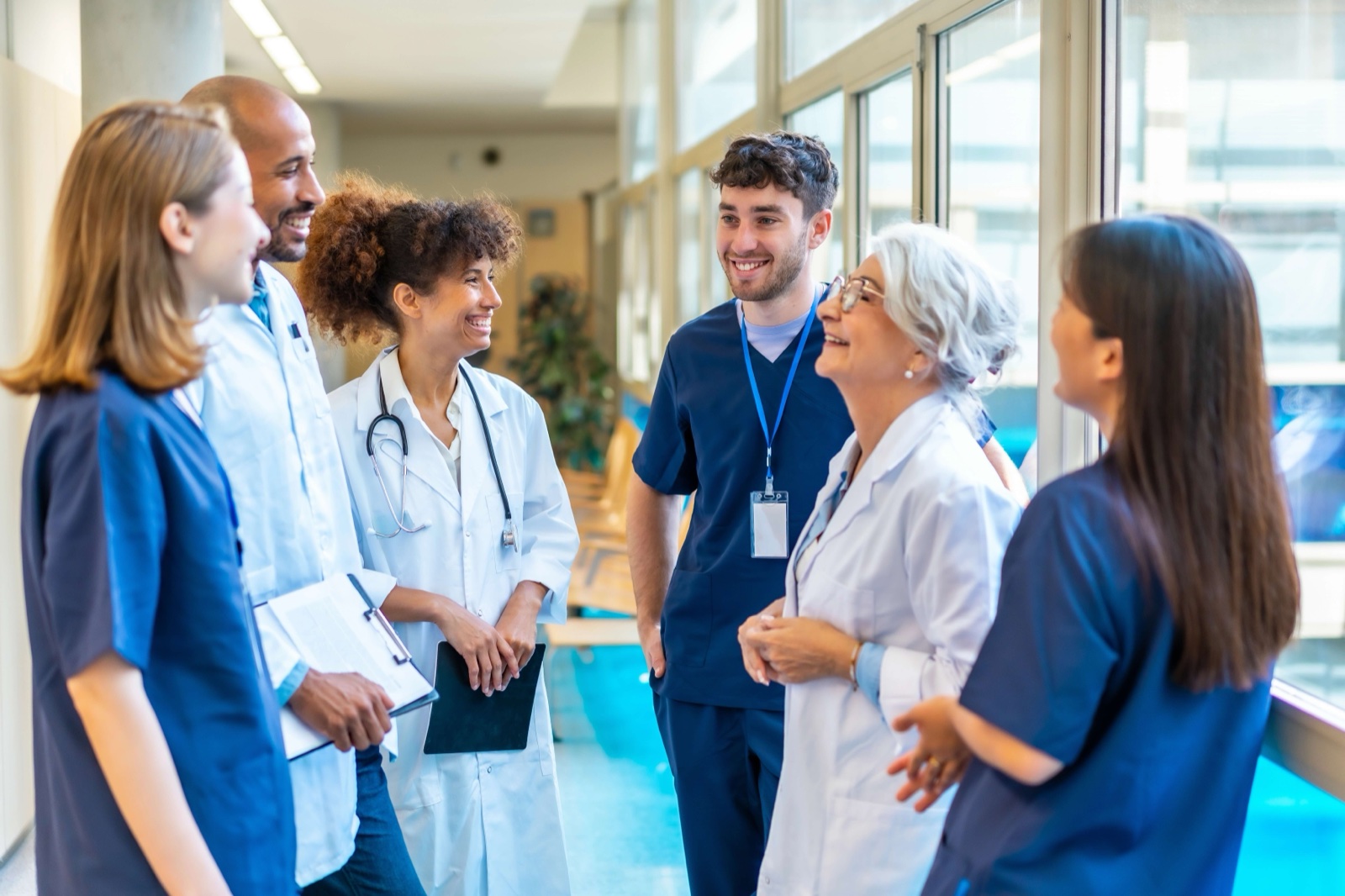 A care team talking together in a hospital corridor